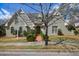 Charming home showcasing a brick walkway, well-manicured lawn, and beautiful architecture at 5 Coventry Close, Avondale Estates, GA 30002