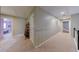 Hallway with two bedrooms on either side and carpeted flooring at 5 Coventry Close, Avondale Estates, GA 30002
