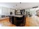 Well-appointed kitchen featuring a central island, modern lighting, and an open layout at 5 Coventry Close, Avondale Estates, GA 30002