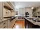 Modern kitchen with stainless steel appliances, granite countertops, and custom cabinetry at 5 Coventry Close, Avondale Estates, GA 30002