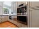 Kitchen with stainless steel appliances and custom cabinetry at 5 Coventry Close, Avondale Estates, GA 30002