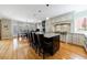 Spacious kitchen with island seating, stainless appliances, and hardwood floors for cooking and entertaining at 5 Coventry Close, Avondale Estates, GA 30002