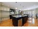 Expansive kitchen includes an island, seating, and integrated storage for a seamless design at 5 Coventry Close, Avondale Estates, GA 30002
