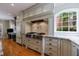 Gourmet kitchen featuring high-end appliances and granite countertops at 5 Coventry Close, Avondale Estates, GA 30002
