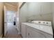 Laundry room featuring a full size washer and dryer with shelving at 5 Coventry Close, Avondale Estates, GA 30002