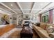 Spacious living room with hardwood floors, a fireplace, custom built-ins, and comfortable seating at 5 Coventry Close, Avondale Estates, GA 30002