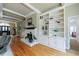 Bright living room with fireplace, built-in shelving and hardwood floors at 5 Coventry Close, Avondale Estates, GA 30002