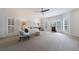Living room features large windows with shutters, neutral decor, and ceiling fan at 5 Coventry Close, Avondale Estates, GA 30002
