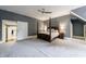 Large main bedroom with four poster bed, ceiling fan, and carpeted flooring at 5 Coventry Close, Avondale Estates, GA 30002