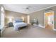 Spacious main bedroom with a carpeted floor, arched windows with plantation shutters, and a vanity at 5 Coventry Close, Avondale Estates, GA 30002