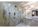Modern shower with glass enclosure, multiple shower heads, and elegant marble-style wall and tile flooring at 5 Coventry Close, Avondale Estates, GA 30002