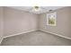 Neutral bedroom features a ceiling fan, carpeting, and natural light from the window at 279 Alex St, Canton, GA 30114