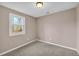 Quaint carpeted bedroom with a window providing natural light at 279 Alex St, Canton, GA 30114