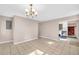 Open dining room with tile floors and chandelier lighting, next to the kitchen at 279 Alex St, Canton, GA 30114