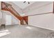 Spacious living room features a wooden staircase and neutral tones at 279 Alex St, Canton, GA 30114