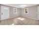 Neutral living area featuring tile floors and sun-drenched windows at 279 Alex St, Canton, GA 30114