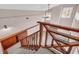 Staircase showcasing wooden banister, leading to the main level and living room at 279 Alex St, Canton, GA 30114