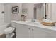 Clean bathroom with white cabinets, bathtub, and framed wall art at 1116 Edinberg Dr # 59, Villa Rica, GA 30180