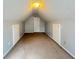 Finished attic featuring carpet, built-ins and a door at 3520 Newberry Ln, Douglasville, GA 30135
