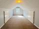 Finished attic with carpet, built-ins and window at 3520 Newberry Ln, Douglasville, GA 30135