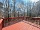 Inviting back deck with wood railings, offering a serene spot to enjoy the wooded scenery at 3520 Newberry Ln, Douglasville, GA 30135