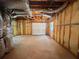 Open basement with garage door and insulated walls awaiting finishing and customization at 3520 Newberry Ln, Douglasville, GA 30135