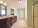 Bathroom boasting a double vanity, tiled floor and neutral paint at 3520 Newberry Ln, Douglasville, GA 30135