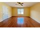 Bright bedroom with hardwood floors, a ceiling fan and large window at 3520 Newberry Ln, Douglasville, GA 30135