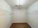 Walk-in closet with carpet flooring, wire shelving, and a ceiling light at 3520 Newberry Ln, Douglasville, GA 30135