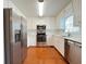 Modern kitchen featuring stainless steel appliances, white cabinets, and ample counter space at 3520 Newberry Ln, Douglasville, GA 30135