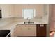 Bright kitchen with white cabinets, updated countertops, and stainless steel dishwasher at 3520 Newberry Ln, Douglasville, GA 30135