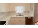 Bright kitchen with white cabinets, updated countertops, and stainless steel dishwasher at 3520 Newberry Ln, Douglasville, GA 30135
