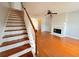 Living room with fireplace, hardwood floors and staircase at 3520 Newberry Ln, Douglasville, GA 30135