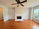Spacious living room with hardwood floors and a charming fireplace, bathed in natural light at 3520 Newberry Ln, Douglasville, GA 30135