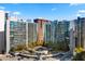 Apartment complex with luxurious amenities and a stunning rooftop pool surrounded by lush greenery at 44 Peachtree Nw Pl # 1328, Atlanta, GA 30309