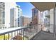 Balcony view of a vibrant cityscape featuring a variety of modern buildings at 44 Peachtree Nw Pl # 1328, Atlanta, GA 30309