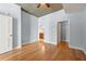 Bedroom with hardwood floors, ensuite bathroom, and walk-in closet at 44 Peachtree Nw Pl # 1328, Atlanta, GA 30309