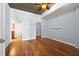 Bedroom with hardwood floors, walk in closet, ensuite bathroom, and ceiling fan at 44 Peachtree Nw Pl # 1328, Atlanta, GA 30309