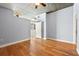 Bedroom with hardwood floors and open doorway to kitchen at 44 Peachtree Nw Pl # 1328, Atlanta, GA 30309