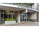 Exterior of the building entrance featuring modern architectural details and inviting landscaping at 44 Peachtree Nw Pl # 1328, Atlanta, GA 30309