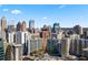 Panoramic city view from a high-rise featuring a vibrant skyline and modern buildings at 44 Peachtree Nw Pl # 1328, Atlanta, GA 30309