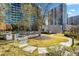 Landscaped courtyard with seating and walkway nestled among high-rise buildings at 44 Peachtree Nw Pl # 1328, Atlanta, GA 30309