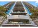 Modern high-rise exterior with balconies and floor-to-ceiling windows in an urban setting at 44 Peachtree Nw Pl # 1328, Atlanta, GA 30309