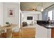 Open-concept living area boasts a sleek modern kitchen with black countertops and a cozy dining nook at 44 Peachtree Nw Pl # 1328, Atlanta, GA 30309