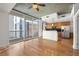 Open-concept living area featuring hardwood floors, modern kitchen with stainless steel appliances and city views at 44 Peachtree Nw Pl # 1328, Atlanta, GA 30309