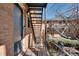 Brick apartment building featuring a balcony, a dark door, and iron staircases at 3510 Nw Roswell Nw Rd # J1, Atlanta, GA 30305