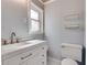 Bright bathroom with modern vanity, sleek fixtures, and white mosaic floors at 3510 Nw Roswell Nw Rd # J1, Atlanta, GA 30305