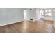 Spacious living room with hardwood floors leading to the dining area and kitchen, great for entertaining at 3510 Nw Roswell Nw Rd # J1, Atlanta, GA 30305