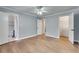 Open bedroom with hardwood floors, ensuite bath, and walk in closet at 3510 Nw Roswell Nw Rd # J1, Atlanta, GA 30305