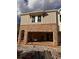 New construction home with a garage under construction with unfinished brick facade at 4523 Moray Dr, Mableton, GA 30126